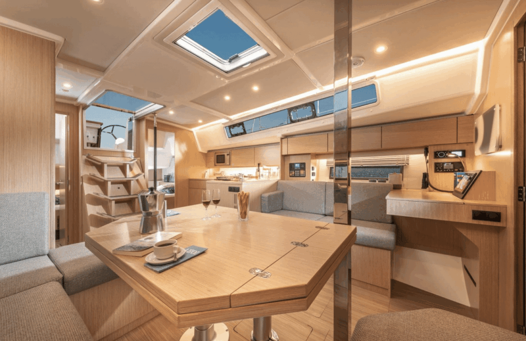 The bright interior of a yacht with a navigation area for chartwork